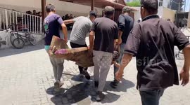 Israeli strike hits Gaza home; civilians killed, injured carried into hospital