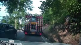 Road roller comes off back of lorry and hits car behind it