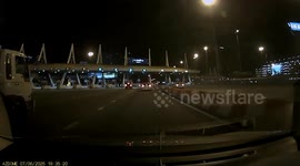 Terrifying moment truck carrying gas tanks crashes into toll booth