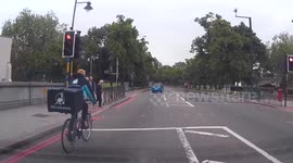 Deliveroo rider has a near miss with a pedestrian at a crossing