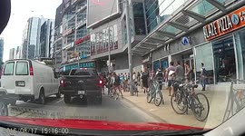 Cyclist tries to weave through traffic, plows into another cyclist