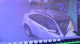 Woman practising driving crashes into gas station
