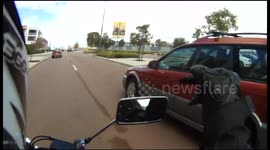 Bike loses his temper at careless motorist