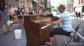Woman asks to play street piano and absolutely kills it
