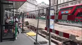 People Wait For Bus At A Bus Stop When Road Is Quite Clearly Not Accesiable