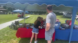 Small girl playing a flip it game to win a prize in Bennington Vermont