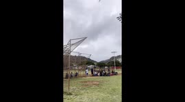 local hawaii baseball game interrupted by fire fighter helicopters | huge fire on Oahu mountain required multiple helicopters and fire trucks to put it out