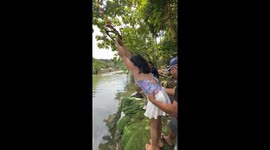 Rope swing across river goes wrong when both people fall into water