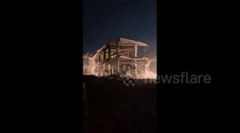 Israeli forces demolish a building in the northern Gaza town of Beit Hanoun