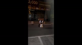 Drunk man fails to spin stone roadblock with belt in Shandong, China