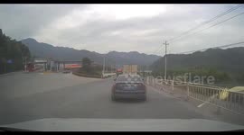 Cadillac crashes into barrier after failed overtake in Zhejiang, China