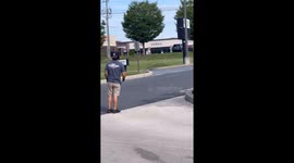 Locals team up to rescue ducklings that fell into drain and reunite them with panicked mother