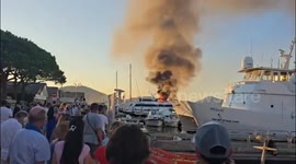 Shocked tourists watch as superyacht catches fire in south of France