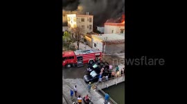 Residents lift illegally parked car to clear path for firefighters to tackle blaze in China
