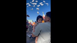 Baby girl bursts into tears after cloud hits her face at the fair