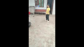 Schoolgirl shows off incredible balance skills by standing on basin rim