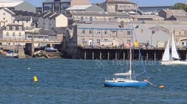 Yachts struggling against the changing tides and weather on the river tamar Torpoint Cornwall