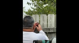 Veteran rescues bird trapped in his fence