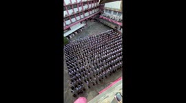 Students perform in mass dance for university ceremony