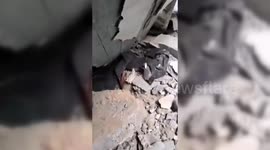 Palestinian Woman Cries for Help Under Rubble in Northern Gaza
