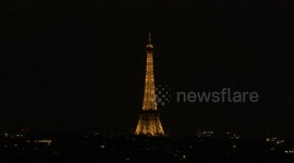 Eiffel Tower illuminated with fireworks, drones on Bastille Day 2025