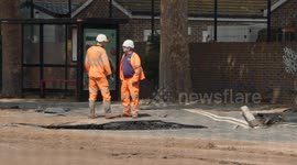Clean up begins after a burst water pipe flooded streets and cut off supply to homes in South London causing residents to have to leave their homes