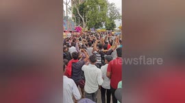 Devotees with LIVE snakes around their necks parade through streets in India