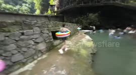 Woman slips and bounces into water during swimming mishap in Hubei, China