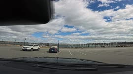 Man chases can across parking lot after accidentally dropping it out of car window