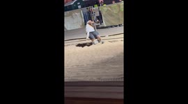 Drunk man repeatedly stumbles and falls into fence at Afro Nation in Algarve, Faro, Portugal