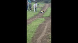 Little girl reacts with wide-eyed surprise after sled ride in Sibaté, Colombia