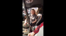 Girl's hair stands up from super-strength car speakers