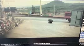 Runaway truck tyre skims heads of gas station workers in terrifying close call captured on CCTV