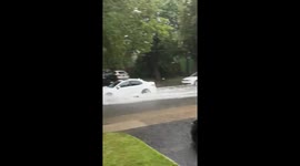 Storm leaves streets flooded as vehicles struggle through high water in Garwood, New Jersey