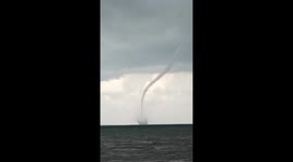 Huge waterspout tornado stuns locals as it forms off Indonesia coastline