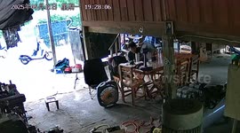 Inexperienced motorcycle rider rears up and crashes into garage