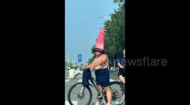 Cyclist wears funny-looking cone-shaped helmet leaving drivers in stitches