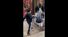 Little boy gets scared by motion sensor prop at Spirit Halloween store
