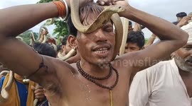 Devotees Carry Snakes During 'Nag Panchami' Fair In Bihar