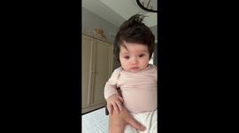 Baby tears up unexpectedly while being held in Douglasville, Georgia, USA