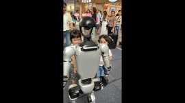Girl loses shoe while trying to trip walking robot in Guangdong, China