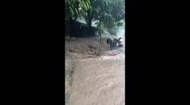 Flash flood surges through homes in the Philippines