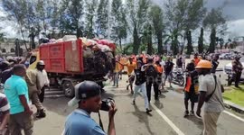 Demonstrating sanitation workers dump heaps of trash on mayor's office in Indonesia