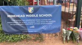 Floral tributes left outside school after fatal bus crash that killed pupil