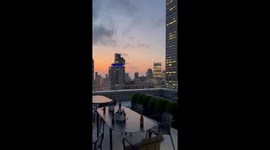 Empire State Building glows in vibrant lights at dusk in New York, USA