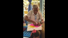 70-year-old man joins young students in classroom weaving activity in Leyte, Philippines