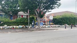 Floral tributes left at school after bus crash kills pupil