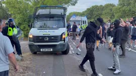 UK: Police and protesters clash outside the Bell Hotel in Essex