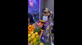 Juice stand serves iced fruit drinks in Bangkok