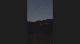 orb with cool energy feild cruising through the evening sky with lots of other mysterious activity going on around it